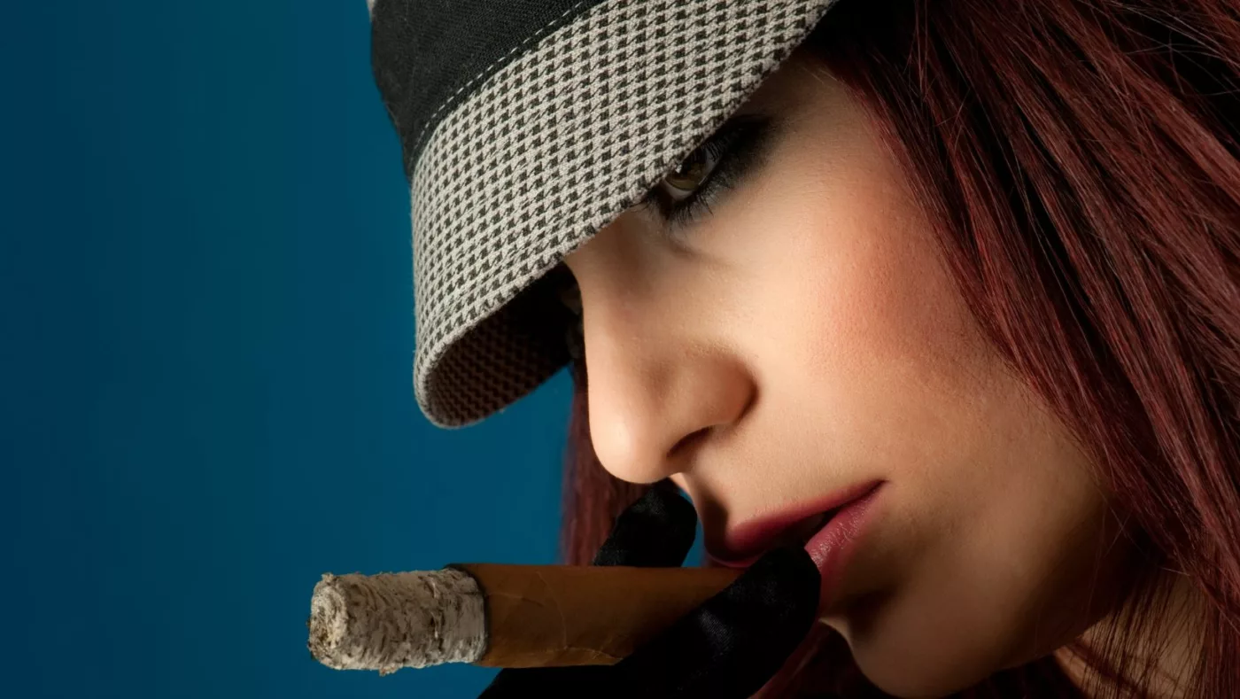 female celebrity smoking a cigar