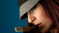 female celebrity smoking a cigar