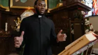 preacher at the pulpit after smoking a cigar